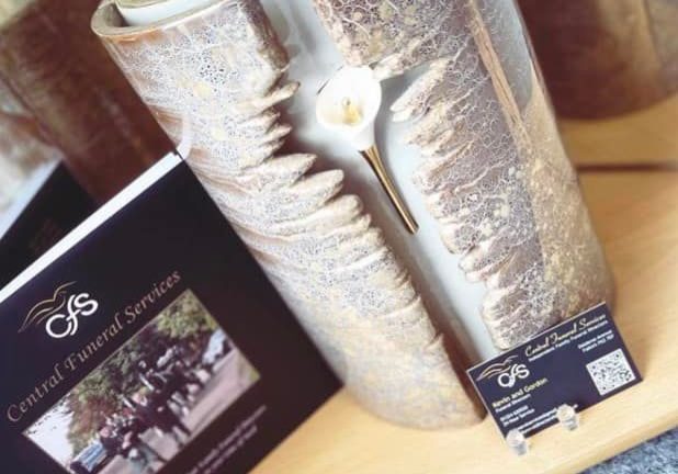 Central Funeral Services brochure and candle