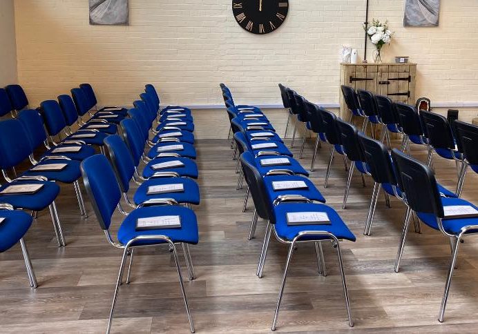 Blue seats in hall for upcoming funeral